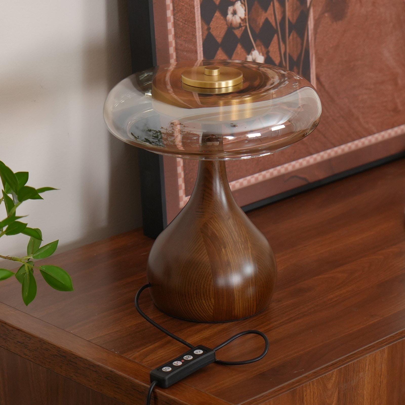 Modern table lamp with walnut wood base and brass details in Scandinavian bedroom