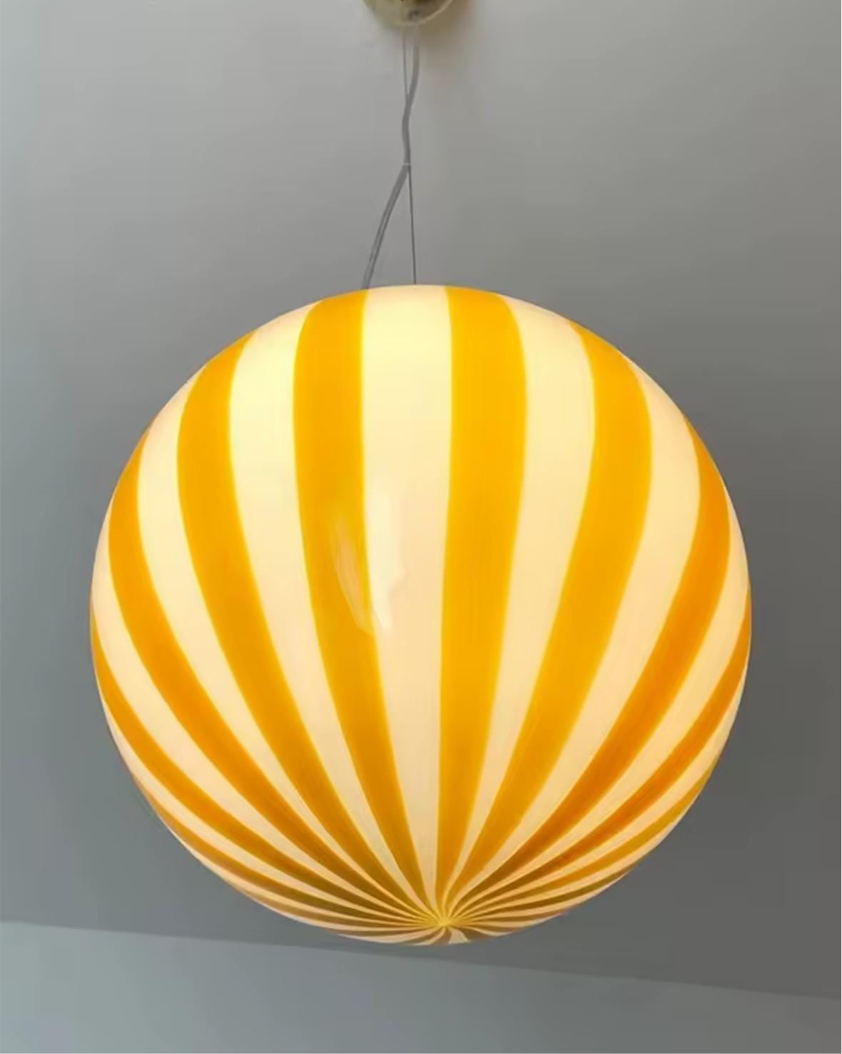 Pendant light featuring hand-blown venetian glass striped design