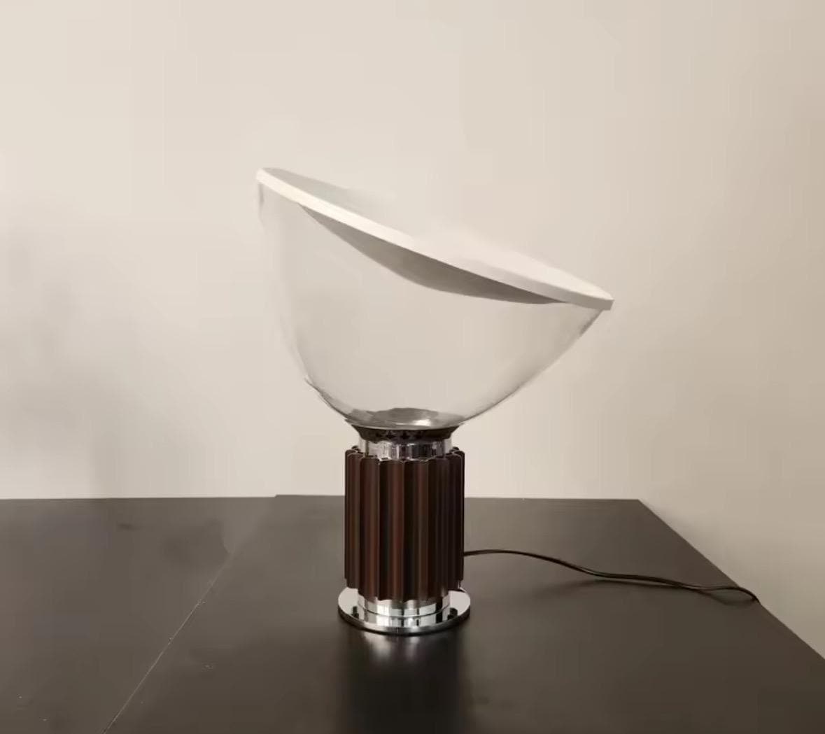 Modern table lamp featuring half-dome reflector and elegant black finish