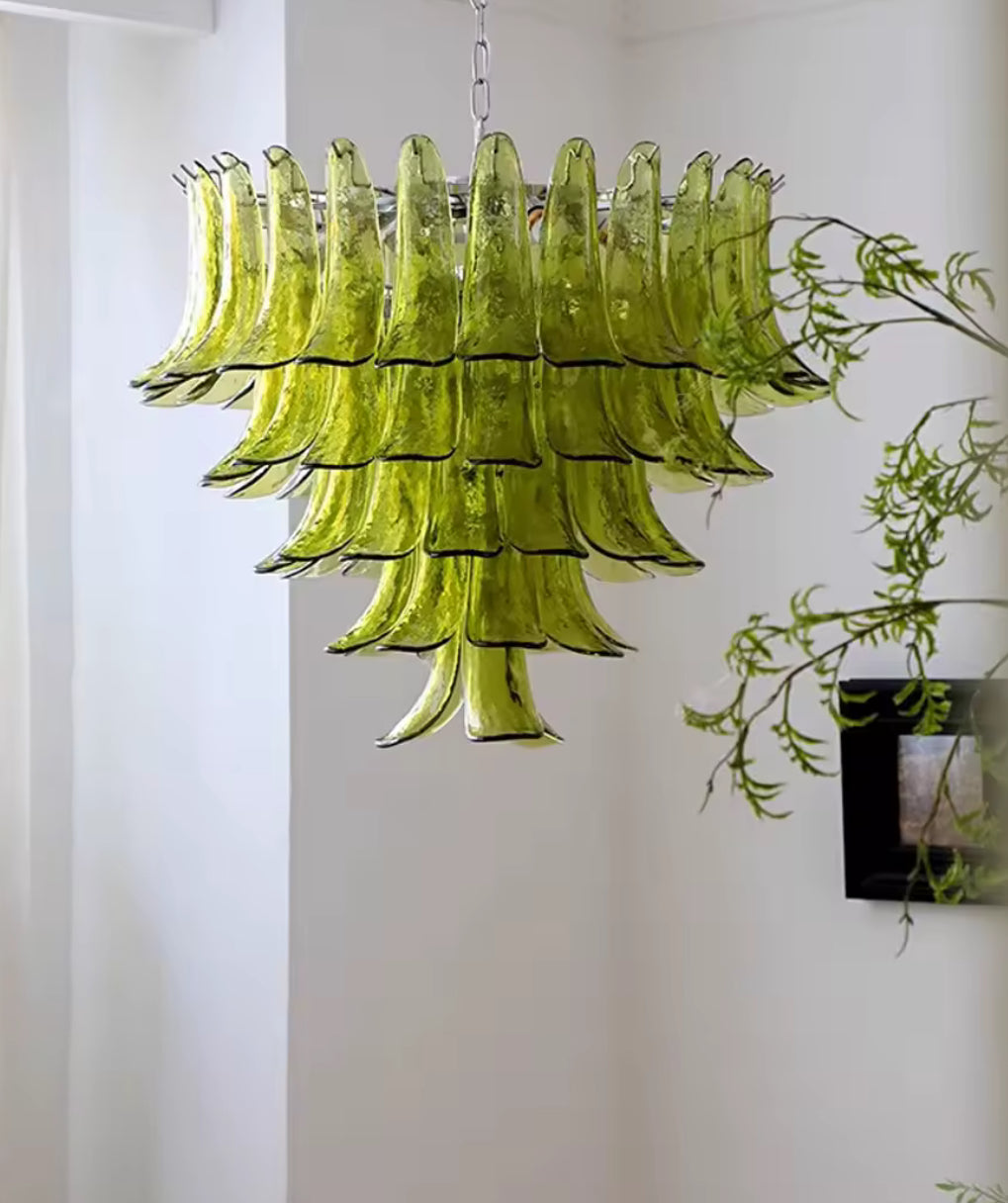 Luxury green Murano chandelier illuminated in sophisticated interior