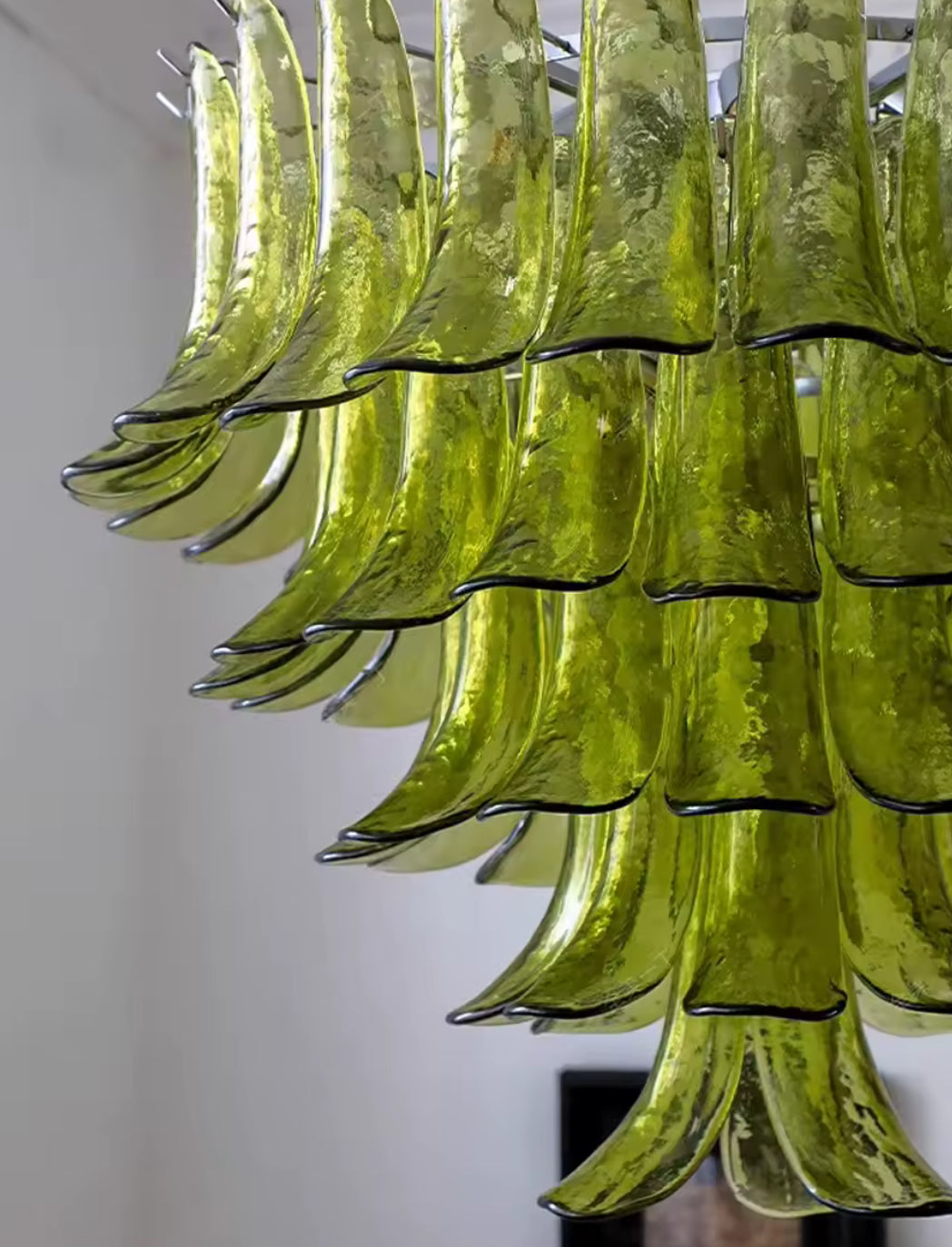 Artisan-crafted venetian glass chandelier in contemporary dining setting