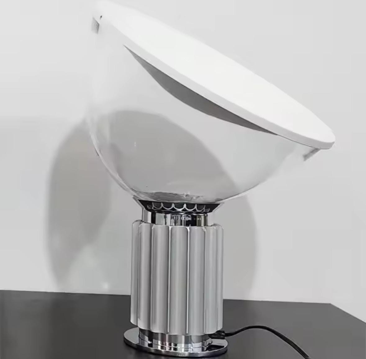 Italian designer lighting with Taccia-style reflector creating mood lighting