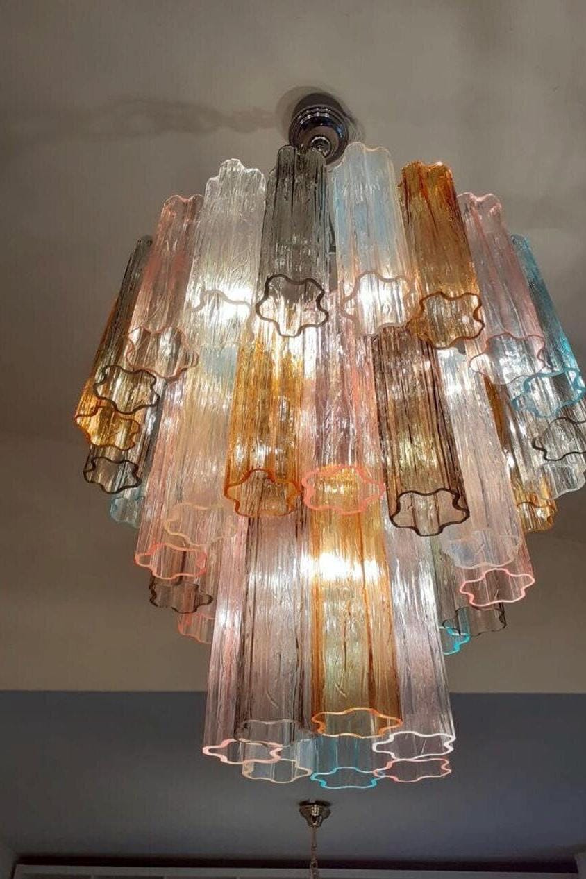 Illuminated multicolor Murano glass lamp showing warm glow and color variations