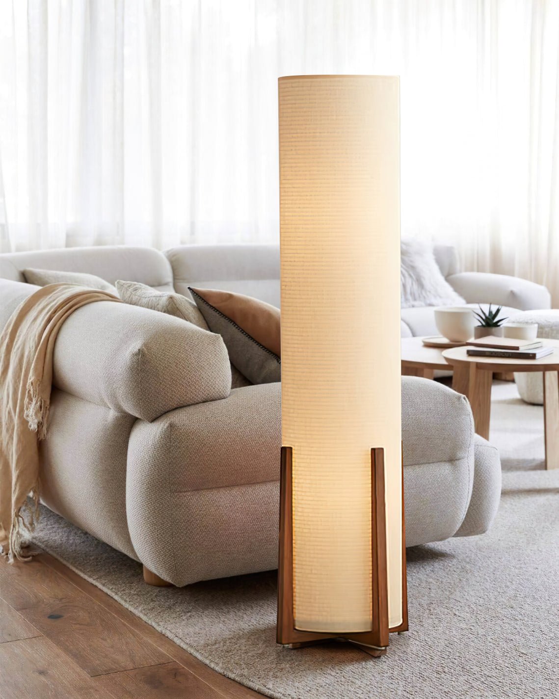 Contemporary fabric floor lamp illuminated in modern bedroom setting