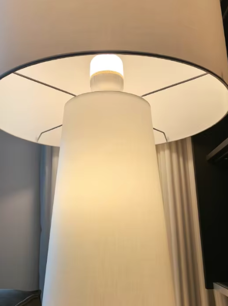 Handcrafted modern floor lamp with soft diffused lighting in home interior