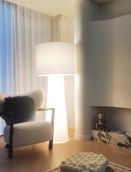 Nordic floor lamp with premium fabric shade in elegant room setting