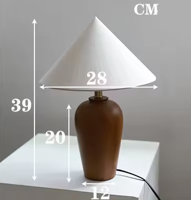 Close-up view of artisan walnut lamp with natural wood finish and grain detail