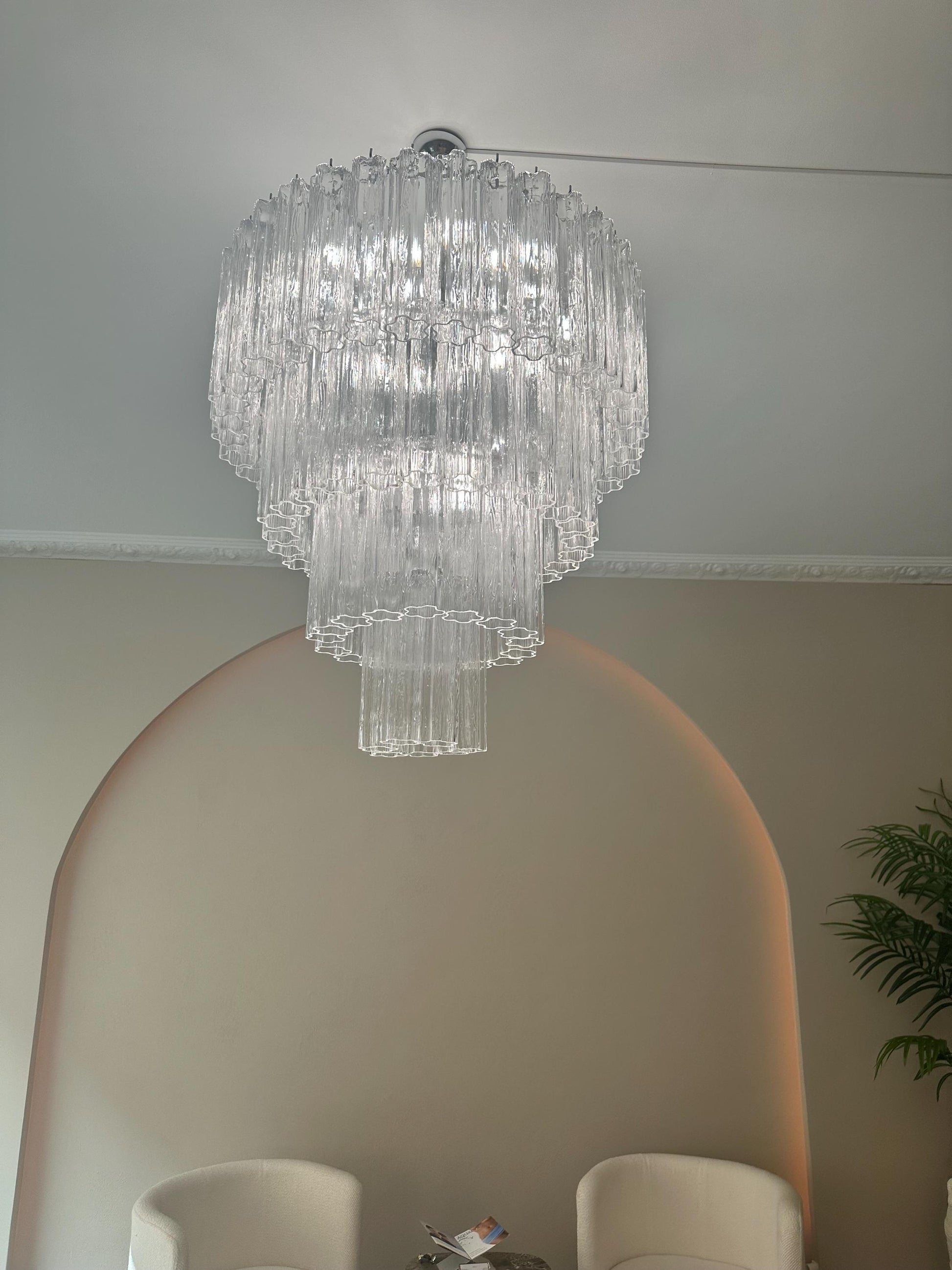 Handcrafted pendant light with glass prisms refracting soft illumination
