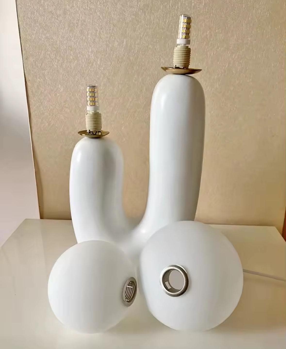 Minimalist sculptural lamp with white ceramic base and glass globes
