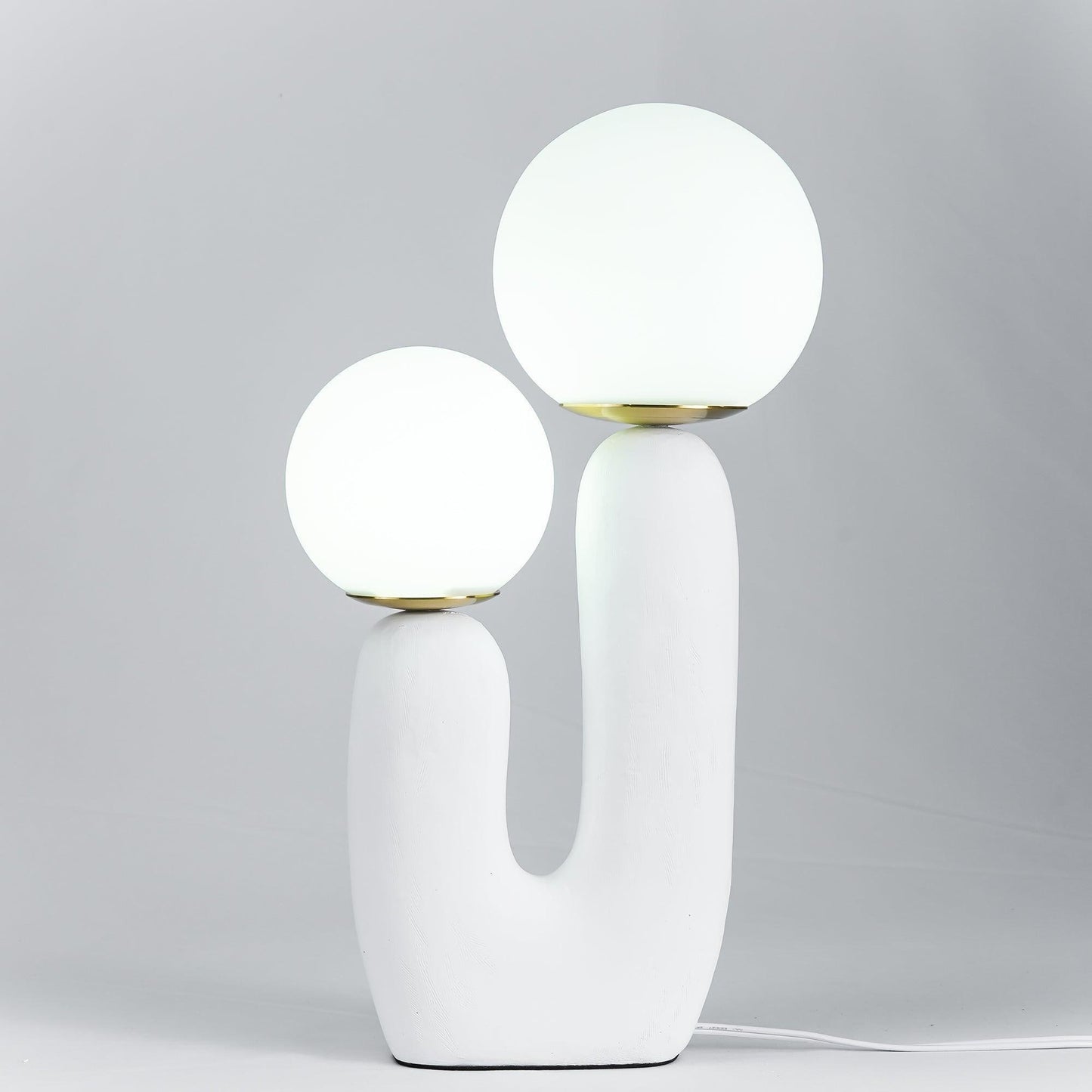 Designer ceramic table lamp creating soft ambient light in modern room