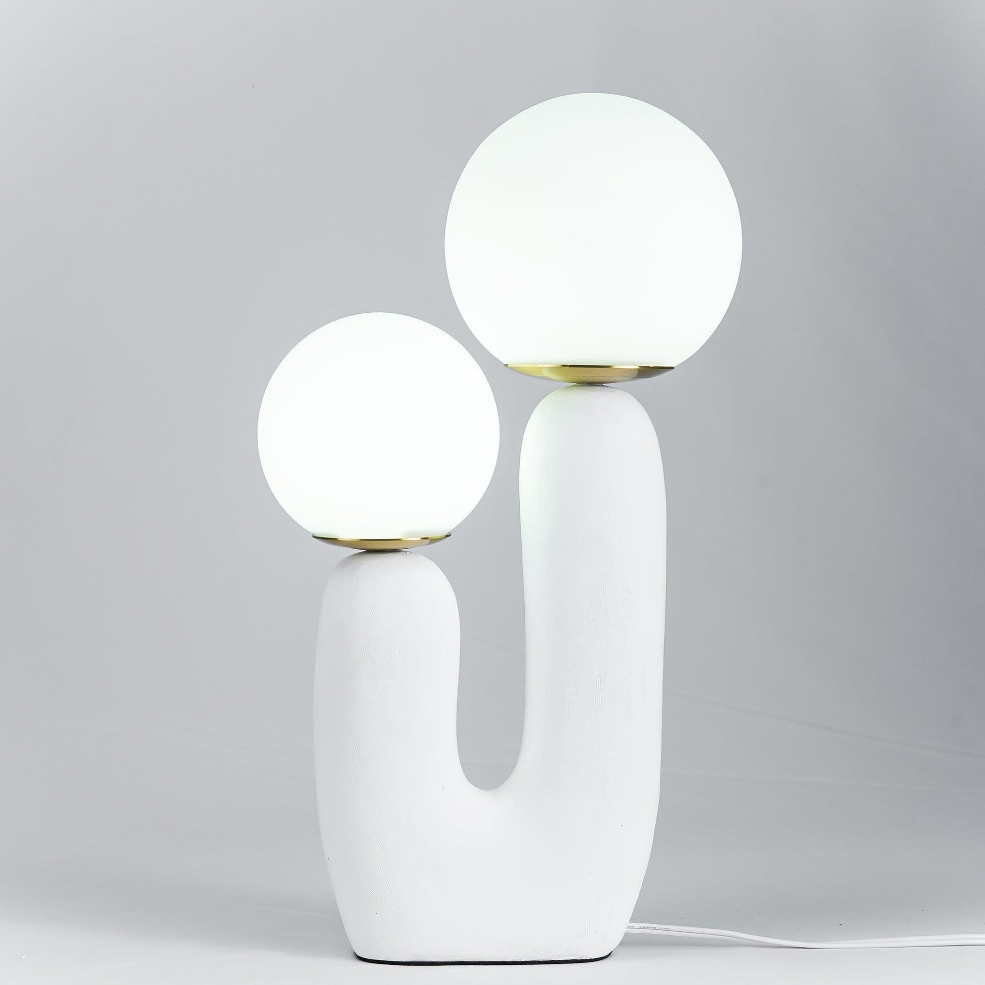 Designer ceramic table lamp creating soft ambient light in modern room