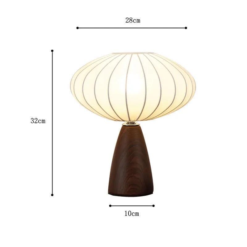Modern table lamp with white fabric shade in Scandinavian bedroom