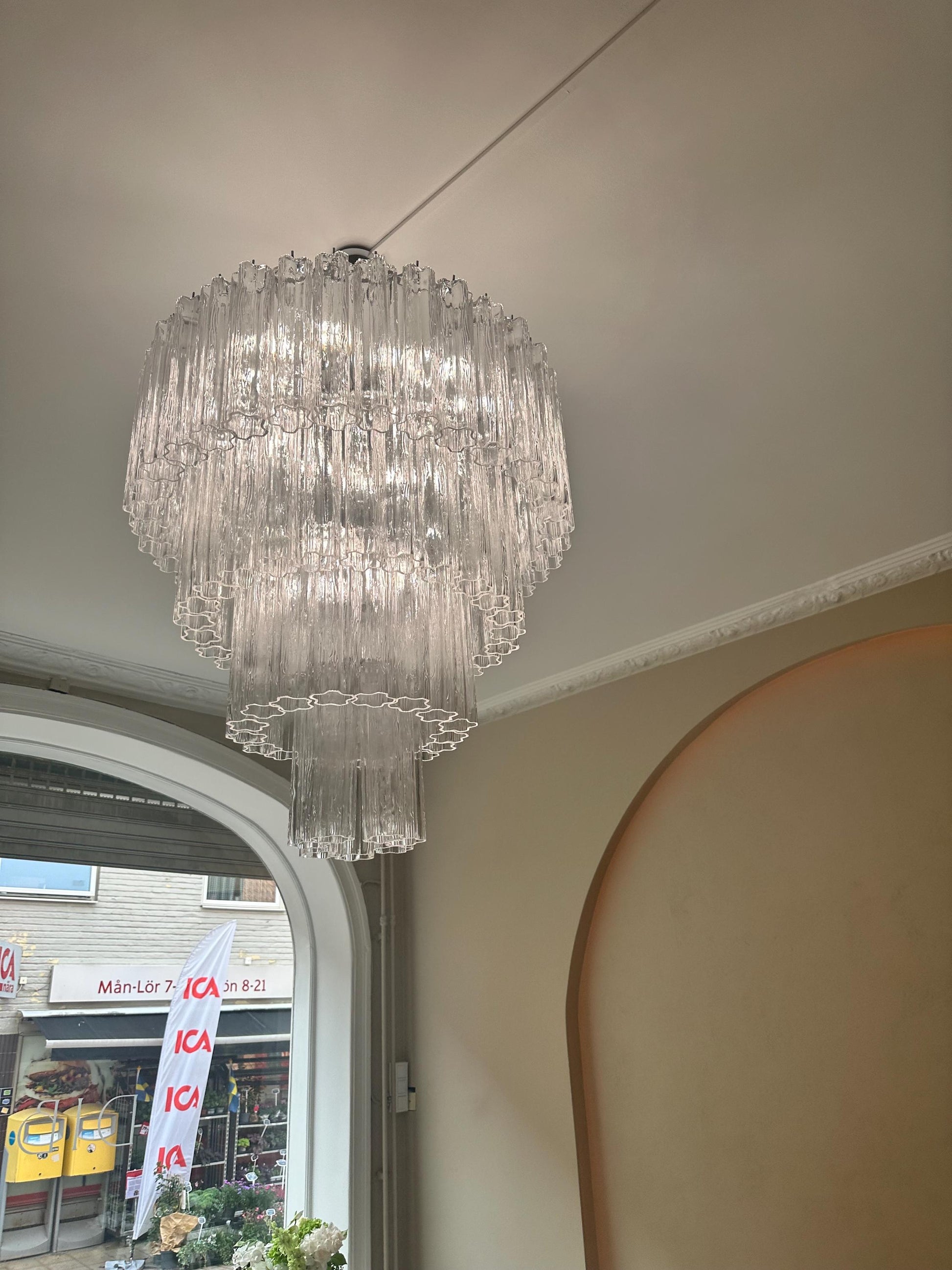 Designer Murano chandelier hanging above contemporary dining table