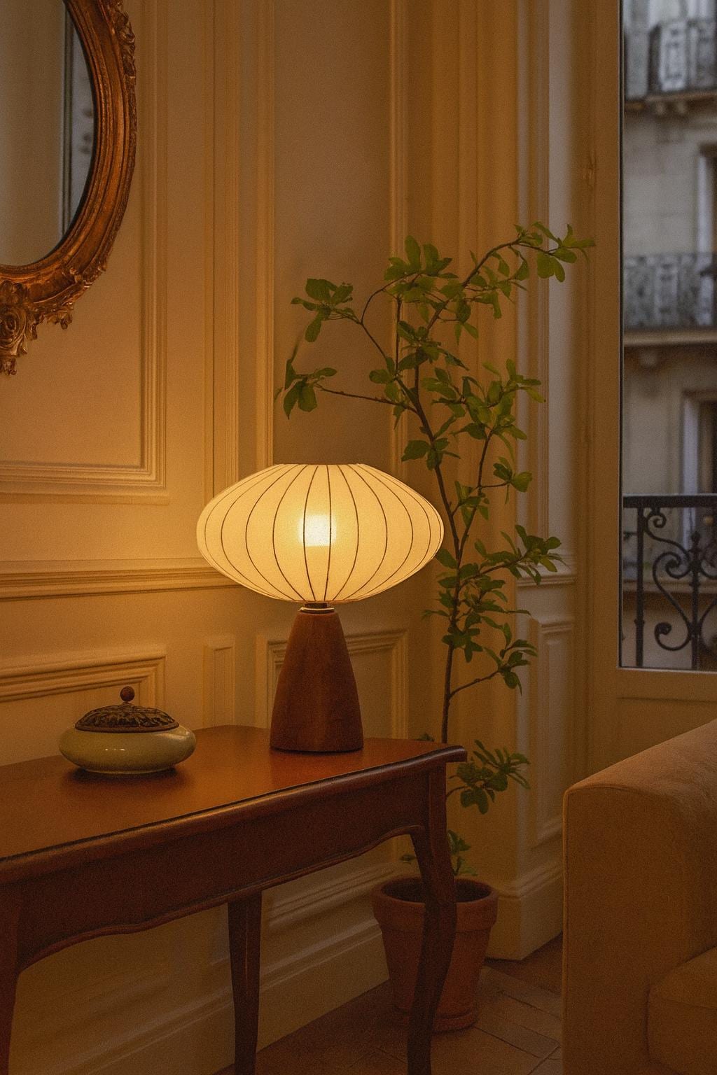 Mid century table lamp with brown wood base and white fabric shade